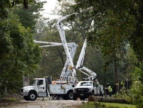 Utility crew cleaning up and repair electric lines near Hickory campus